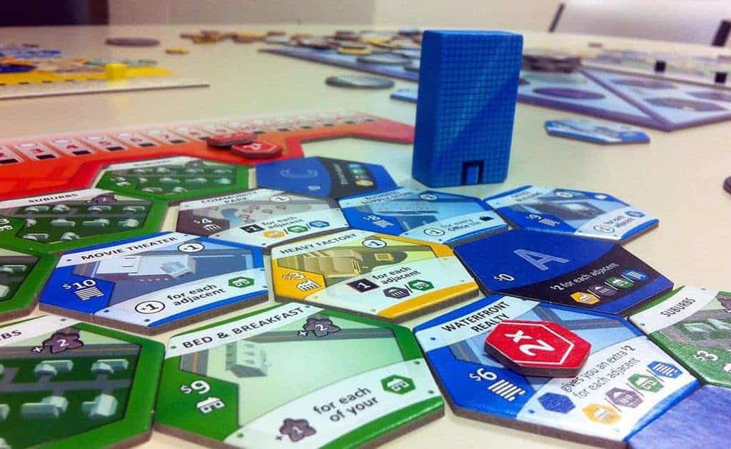 Picking the best three player board games is not easy, but the tested and proven Suburbia made it a no brainer.