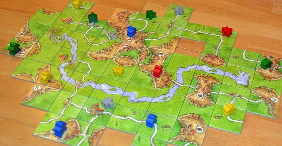 Tile placement board games